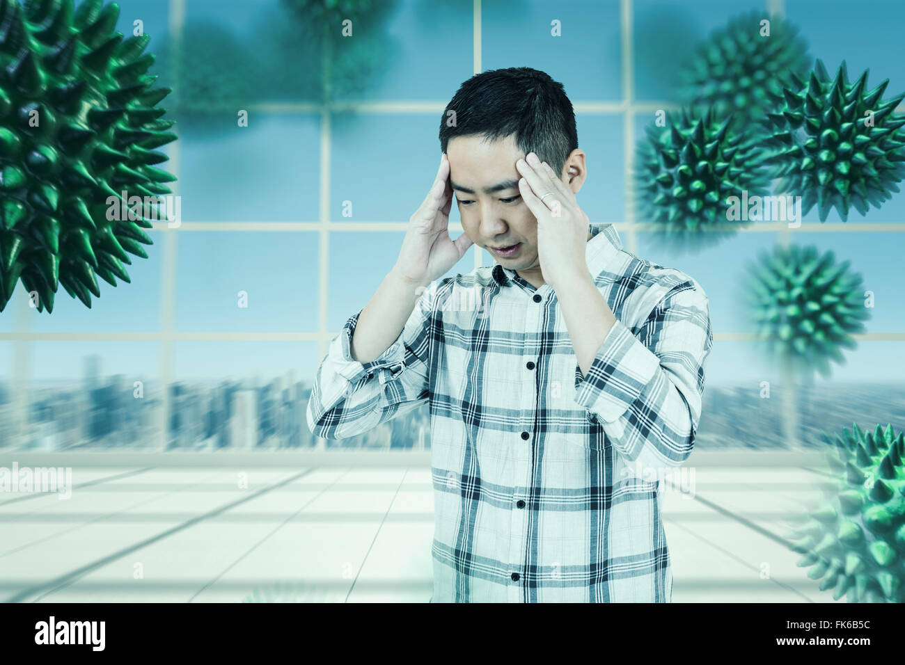 Immagine composita di uomo asiatico ottenendo un mal di testa Foto Stock