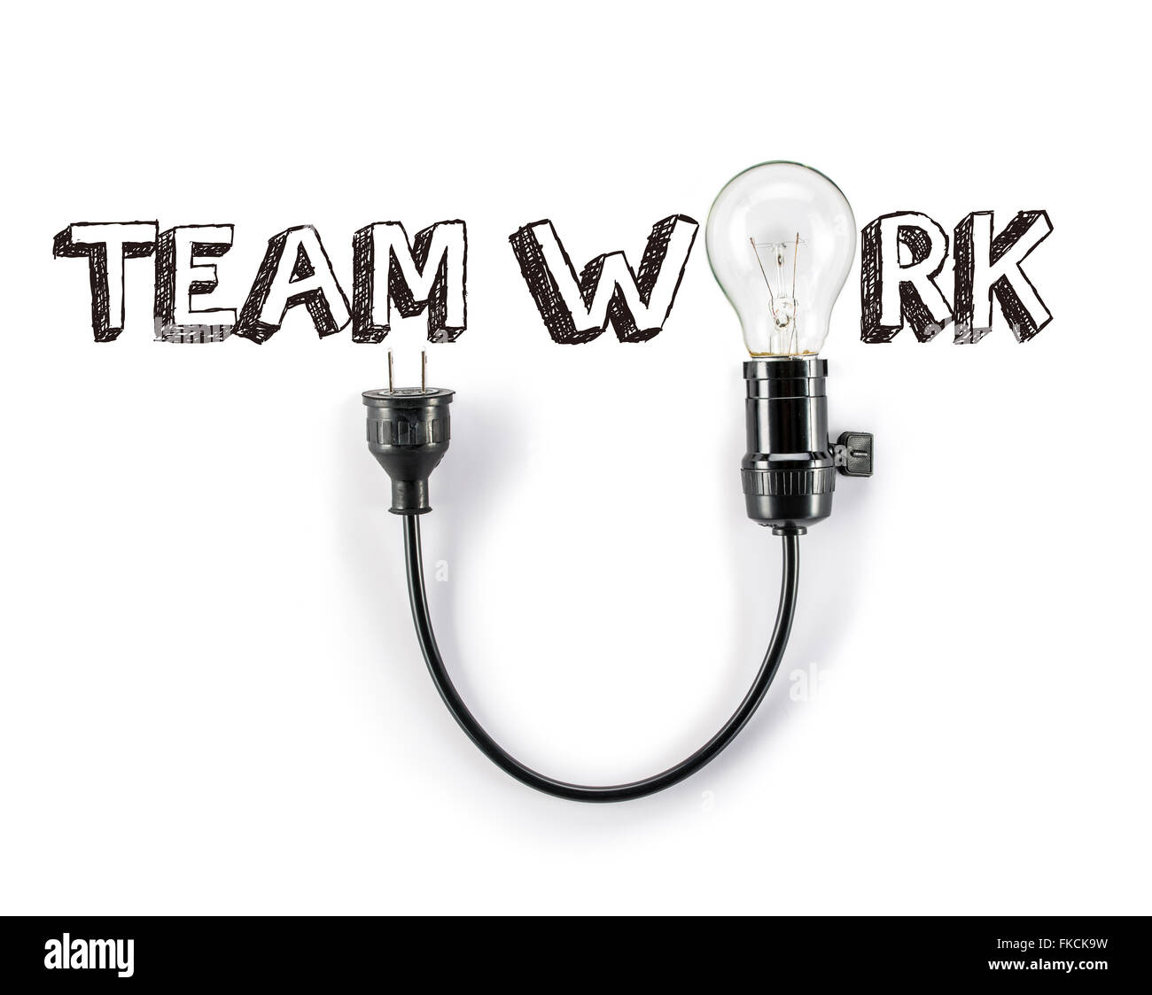Lavoro di squadra una frase e la lampadina a risparmio energetico il brainstorming la scrittura a mano Foto Stock