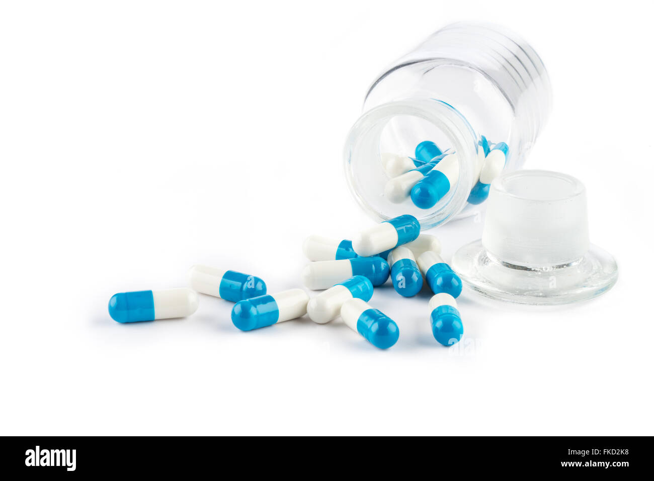 Capsule di colore blu con bottiglia trasparente, la sanità e la medicina farmaco cura Foto Stock