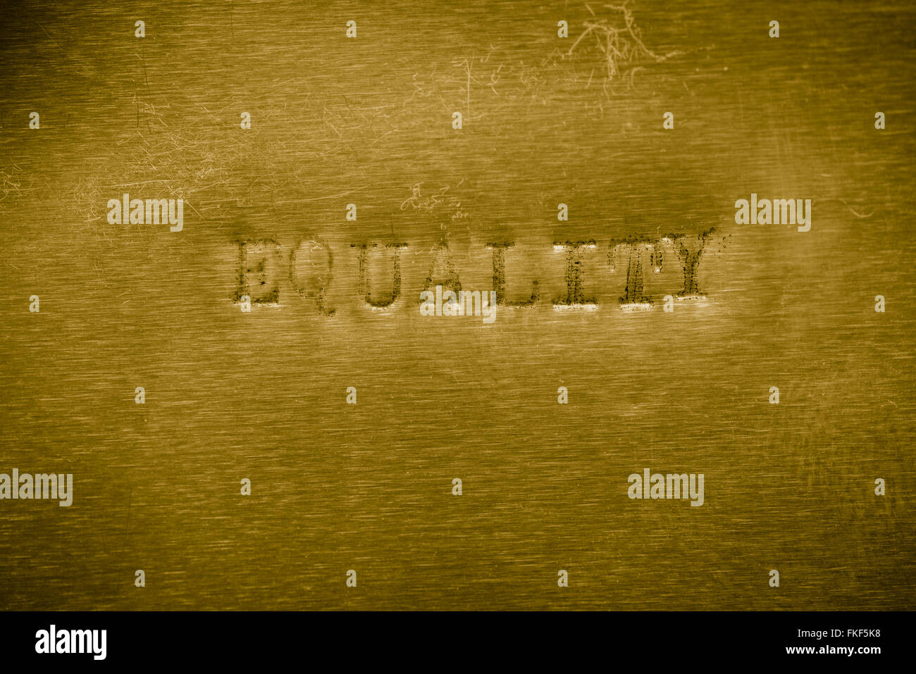 Parola parità stampato su oro metallizzato texture di sfondo Foto Stock