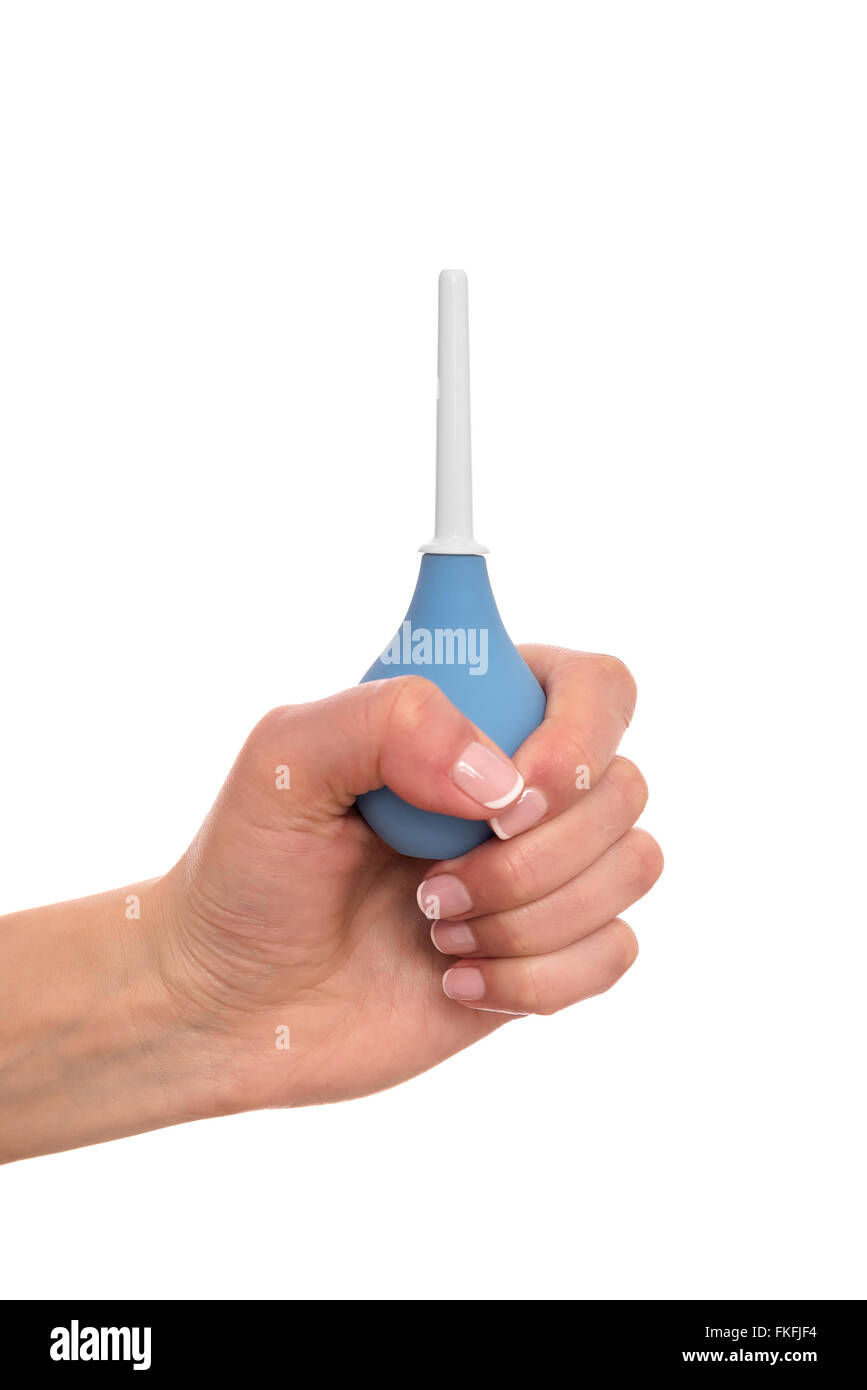 Clistere in una mano su sfondo bianco. Foto Stock