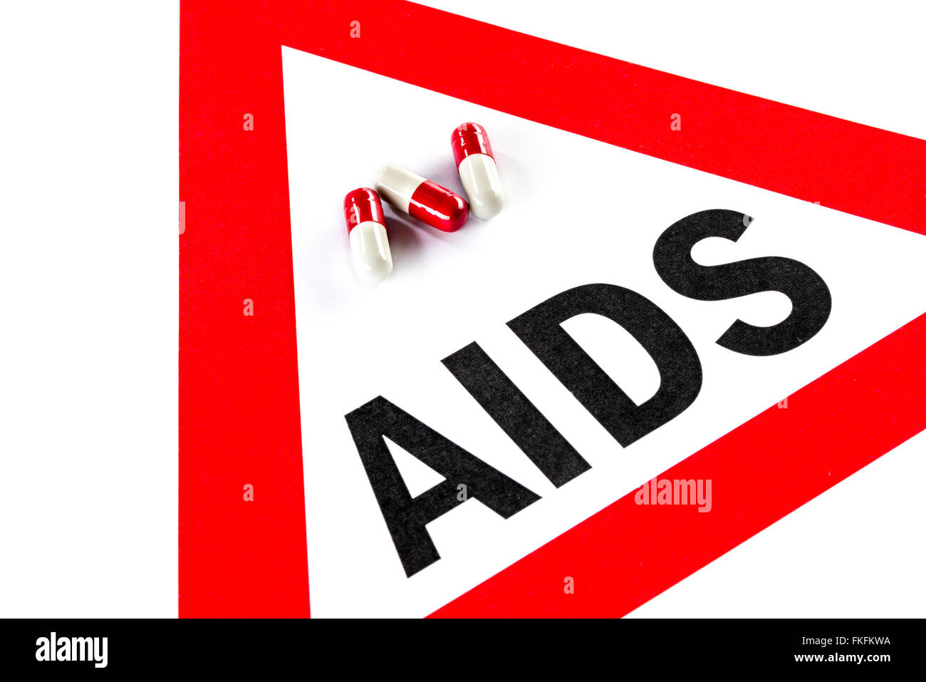 Stop AIDS e HIV, la capsula con il cartello di avviso Questioni sociali Foto Stock