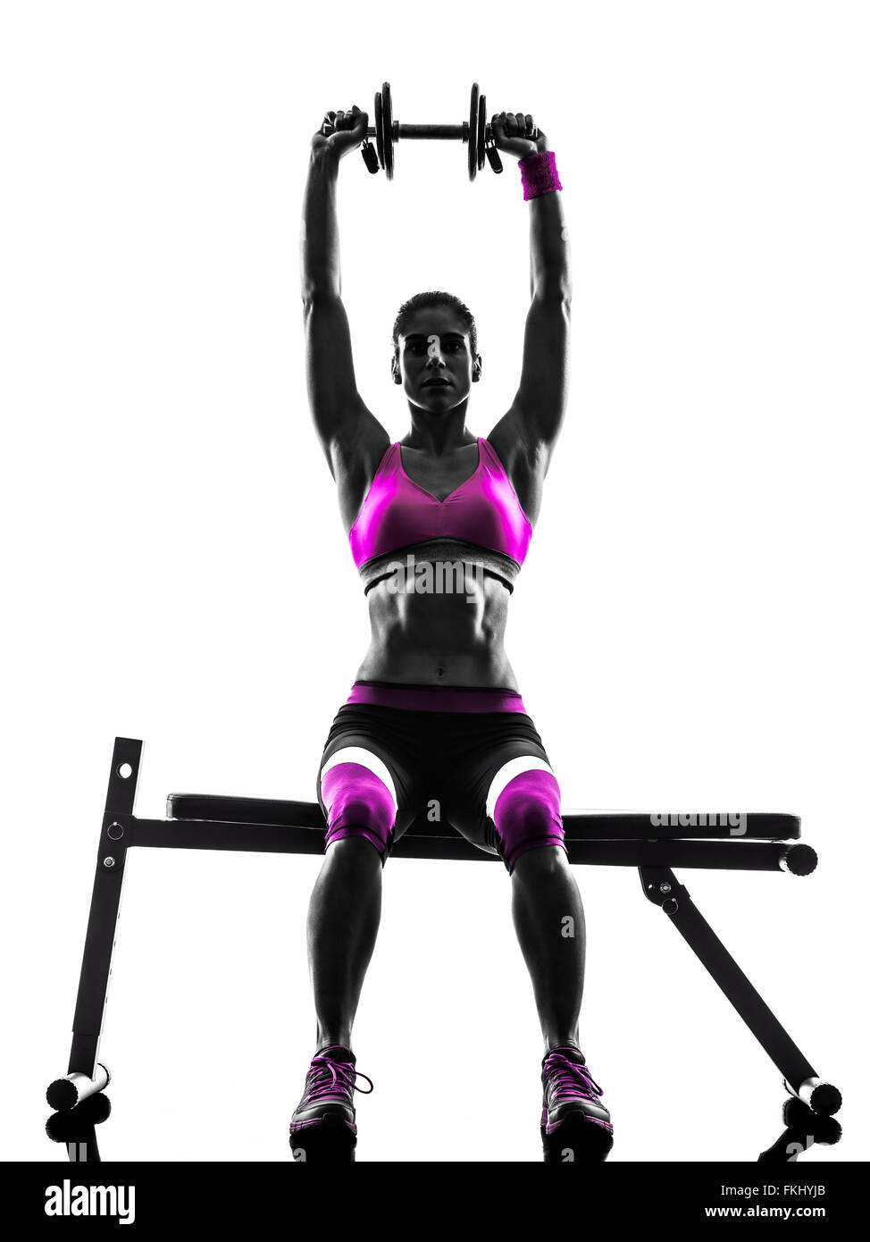 Una donna caucasica pesi di esercizio body building - fitness in studio silhouette isolati su sfondo bianco Foto Stock