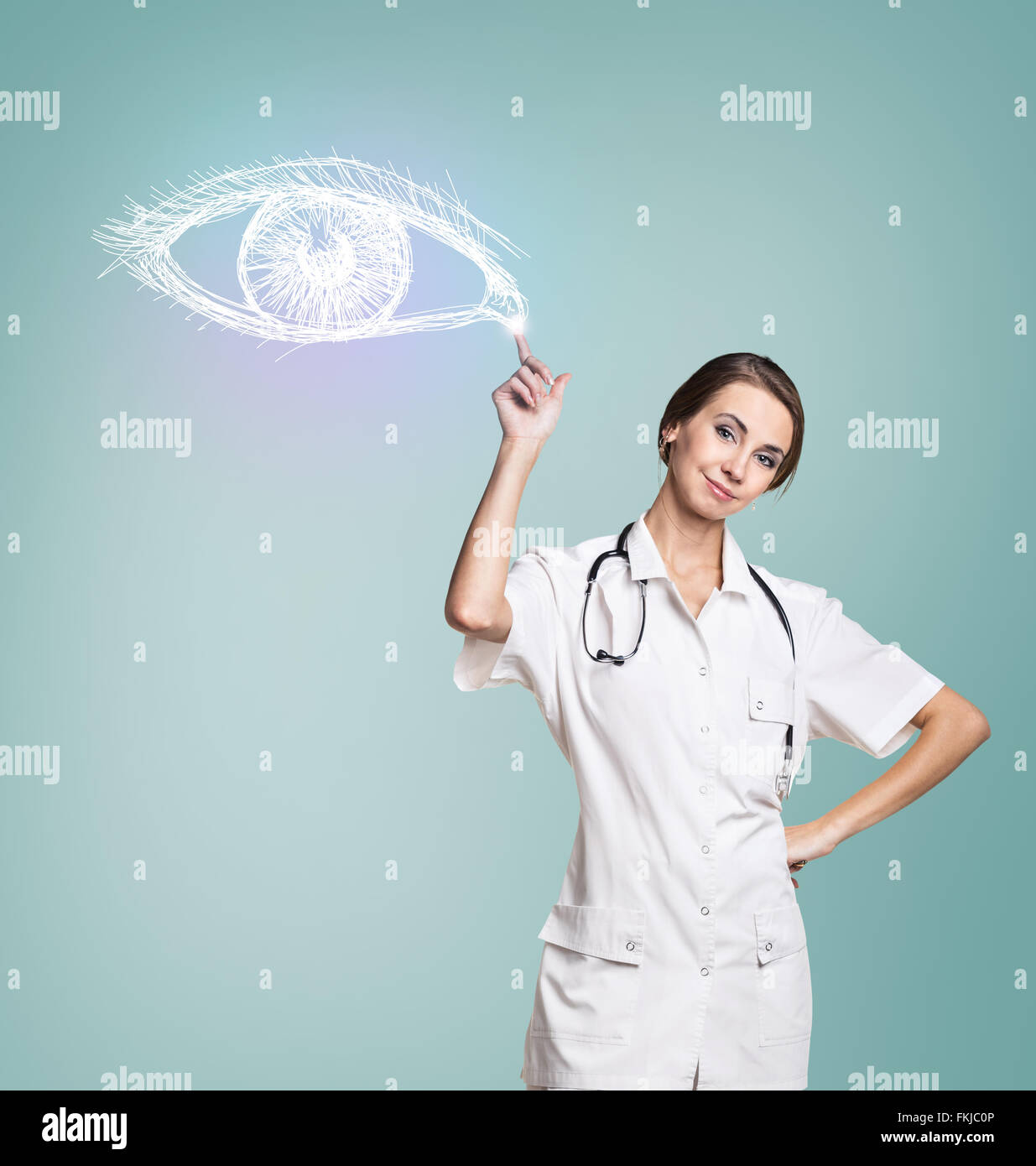 Medico donna in uniforme toccare dipinto occhio umano Foto Stock