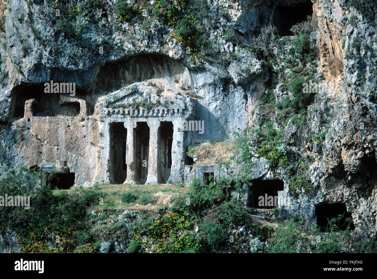 Rock-Carved Tomba di Bellerophon, nell'antica città Lycian di Tlos, vicino a Kalkan, Turchia Foto Stock