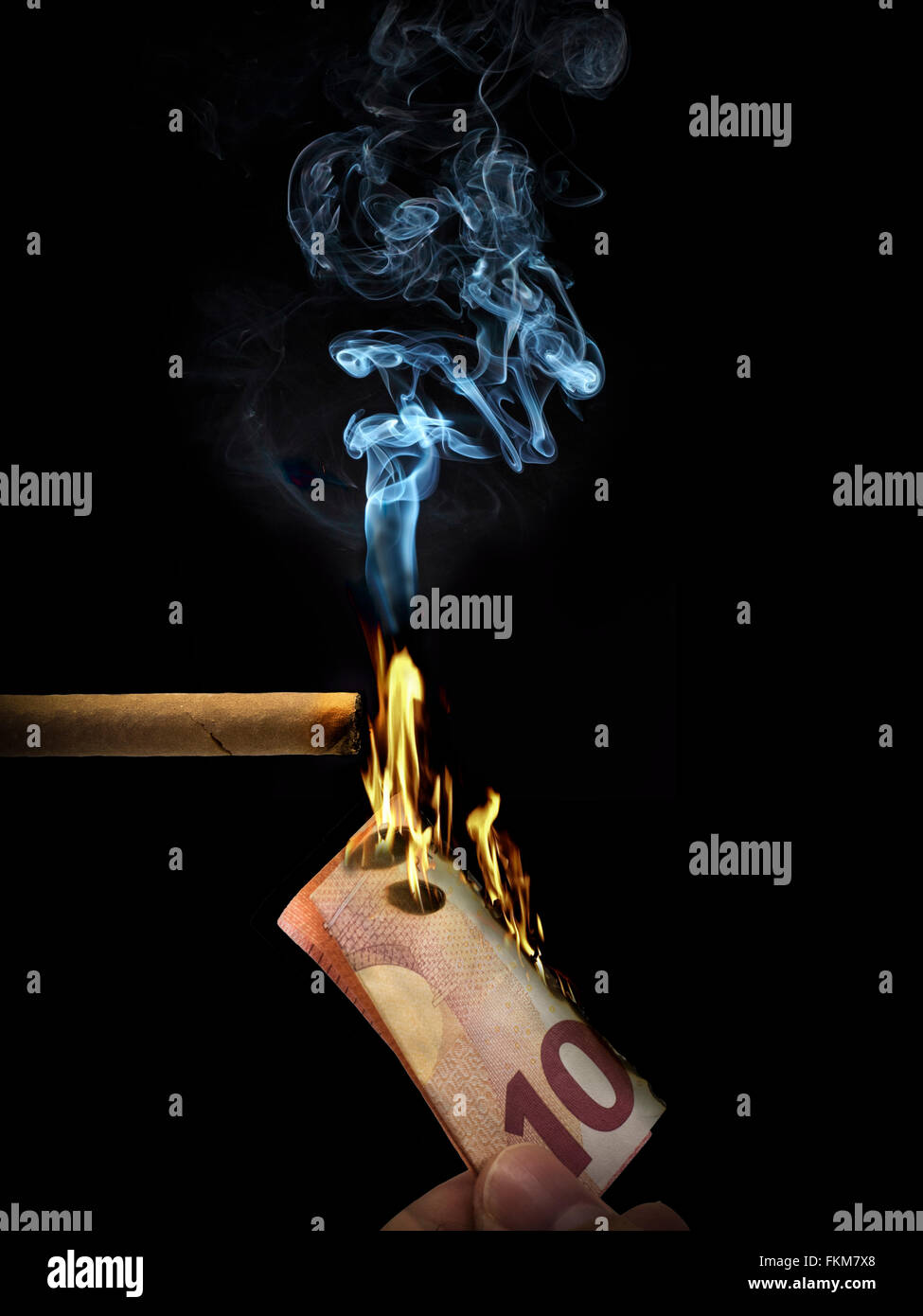 bruciare i soldi Foto Stock