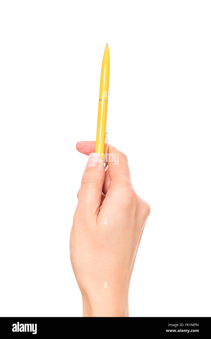 Mano femmina trattiene penna gialla. Foto Stock