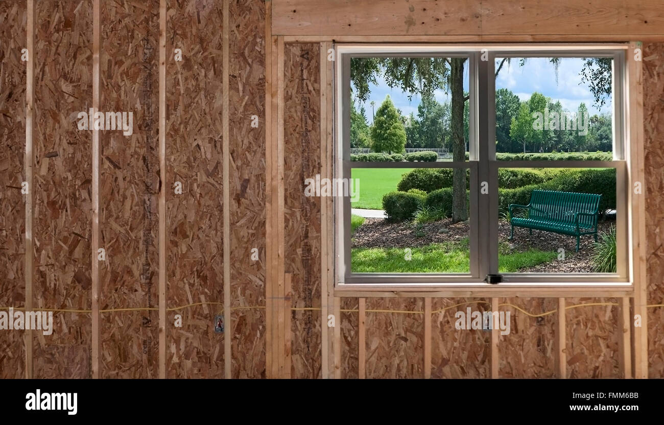 Camera aggiunta costruzione con soffitto spiovente e giardino vista finestra Foto Stock