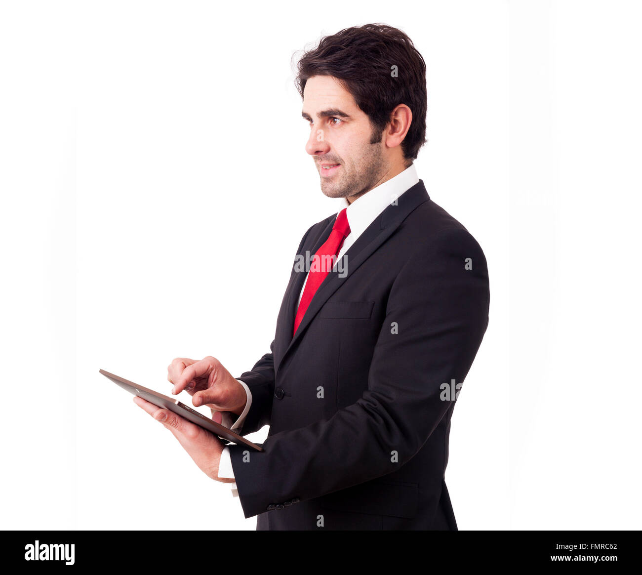 Bello sorridente imprenditore con computer tablet. Isolato su sfondo bianco Foto Stock