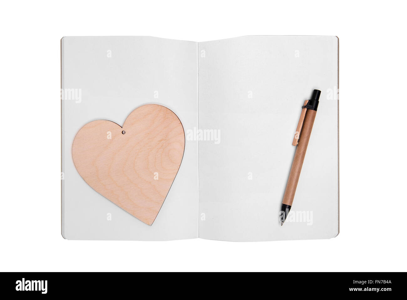 Aprire il notebook con penna e cuore. Foto Stock