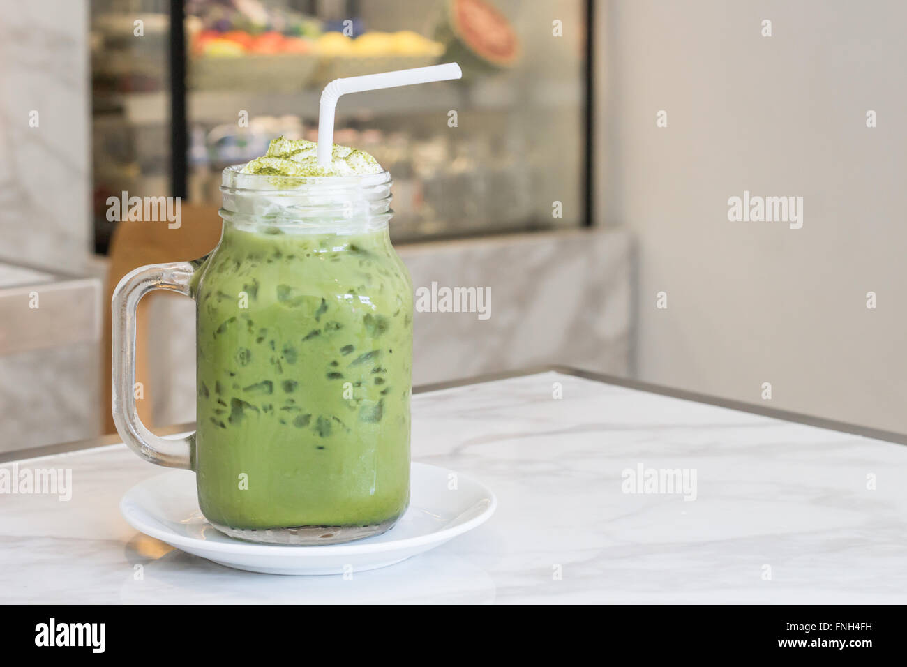 Verde Ice Tea con latte Foto Stock