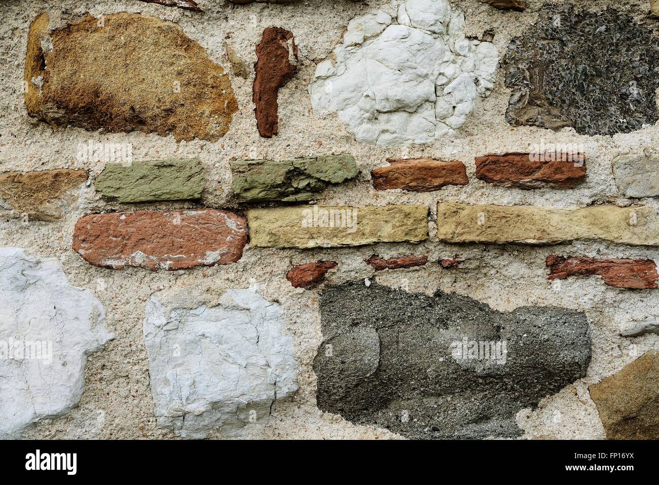 Le pietre e i mattoni colorati wall Foto Stock