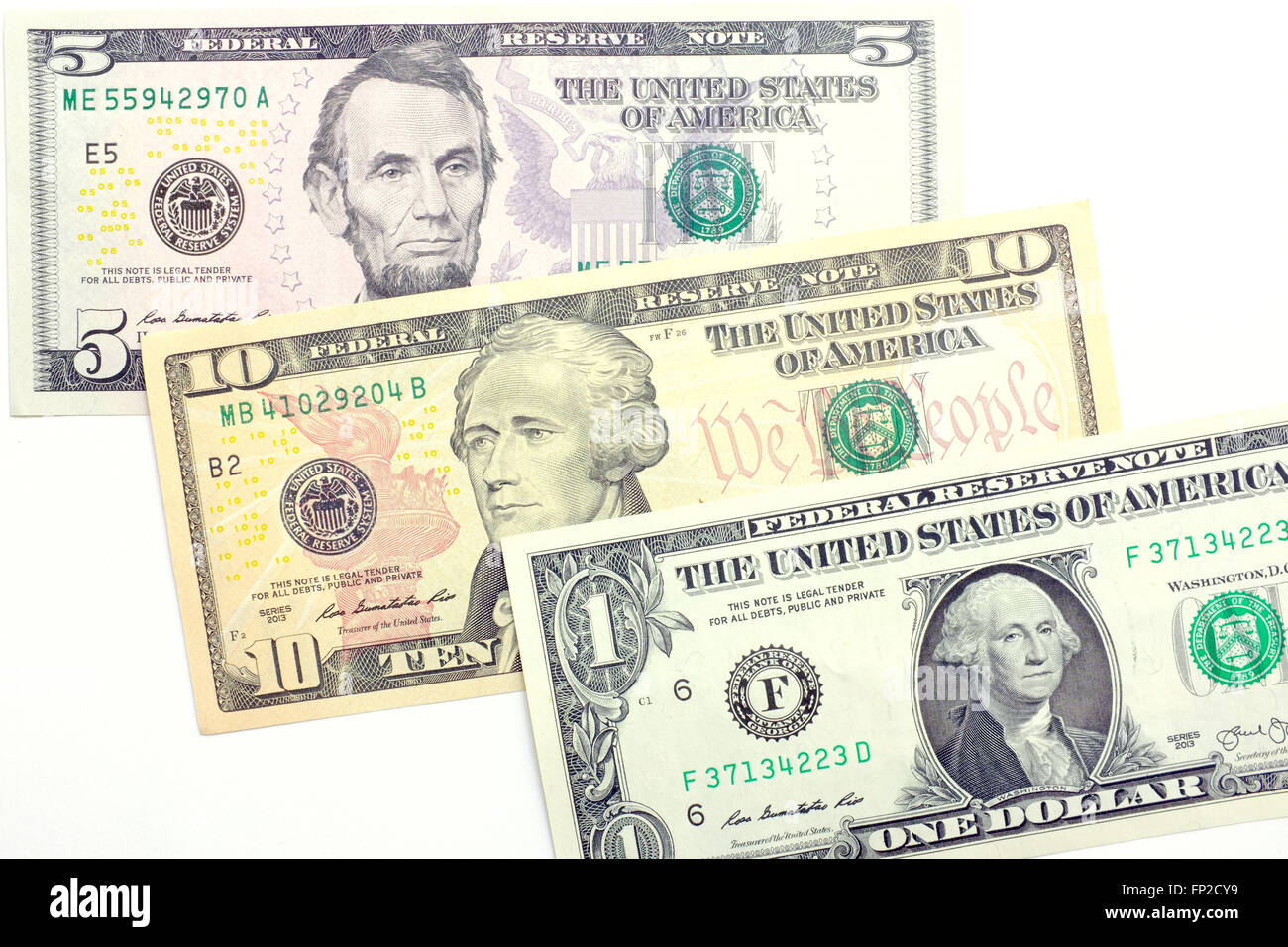 Uno, cinque e dieci dollaro americano note fotografati contro uno sfondo bianco Foto Stock