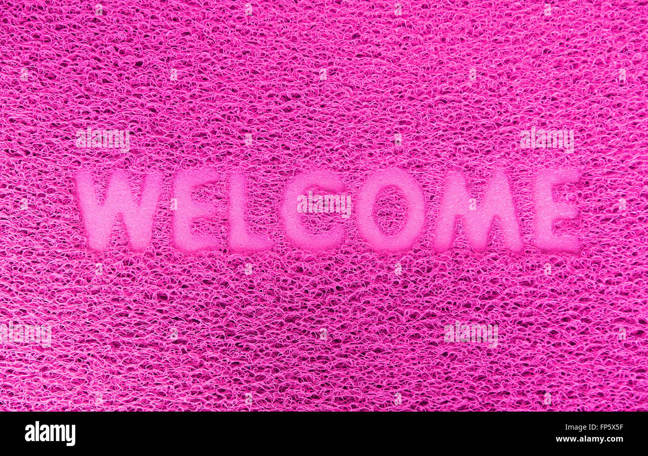 Benvenuti in plastica porta rossa capet texture dello sfondo. Foto Stock