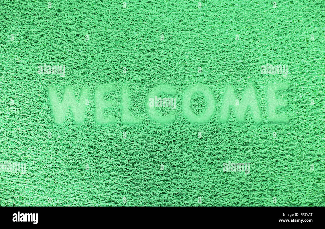 Benvenuti in plastica porta rossa capet texture dello sfondo. Foto Stock