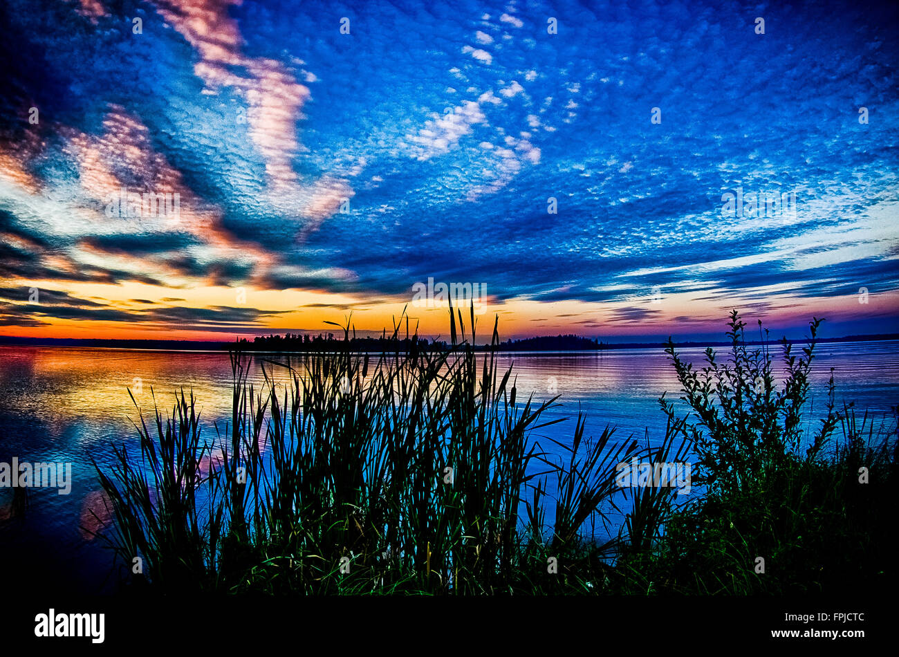 Tramonto sul lago Lac Ste Anne Foto Stock