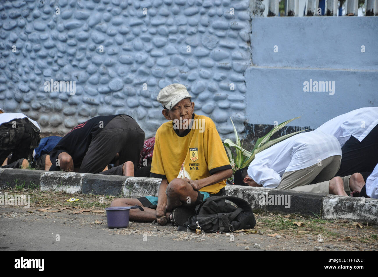 Makassar, Indonesia. Un mendicante. Foto Stock