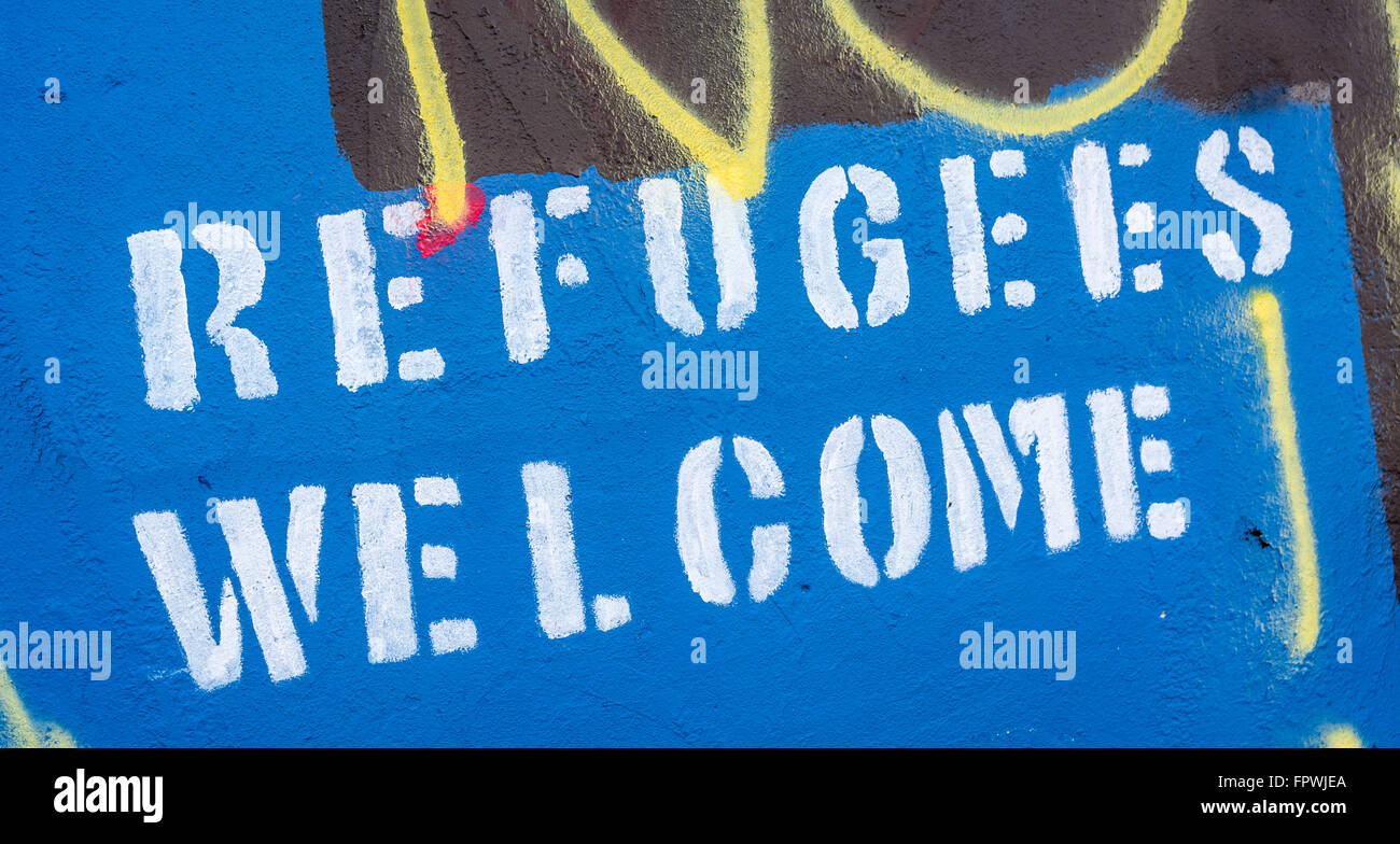 I rifugiati stampata graffiti nella parte occidentale di Belfast Foto Stock