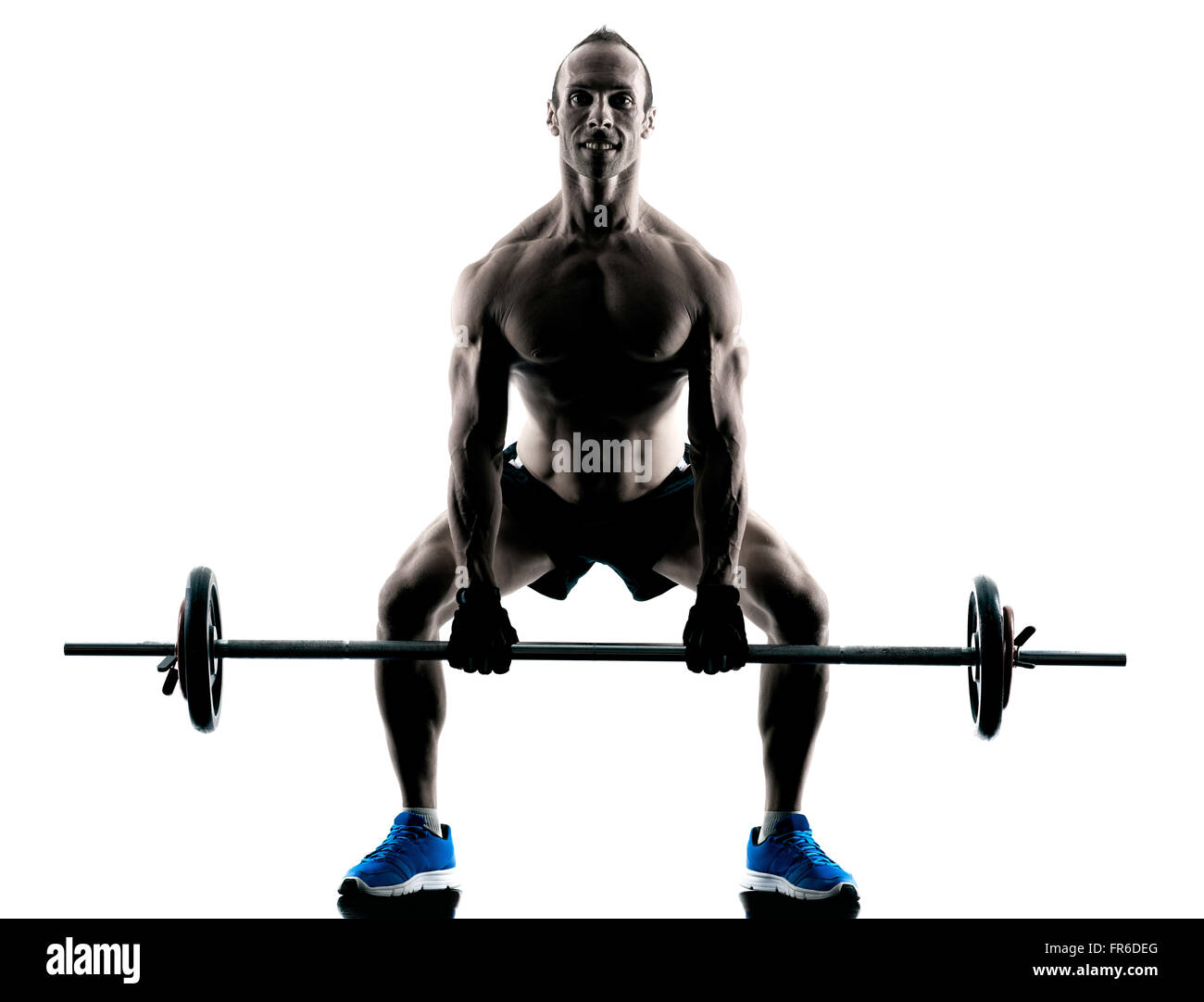 Un uomo caucasico esercizio fitness body building - esercizi di studio in silhouette isolato Foto Stock
