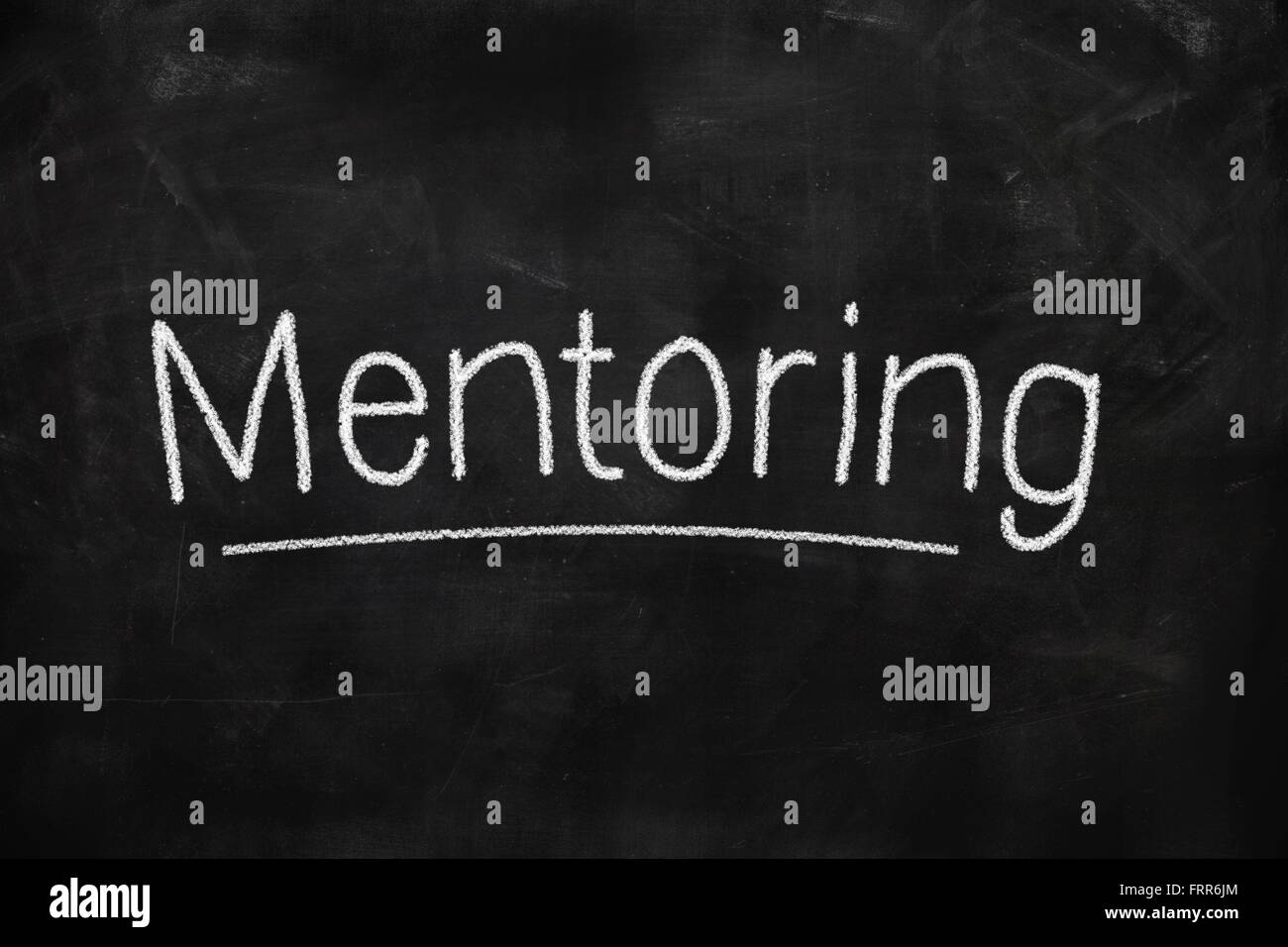 Concetto di mentoring scritti su una lavagna con gesso Foto Stock