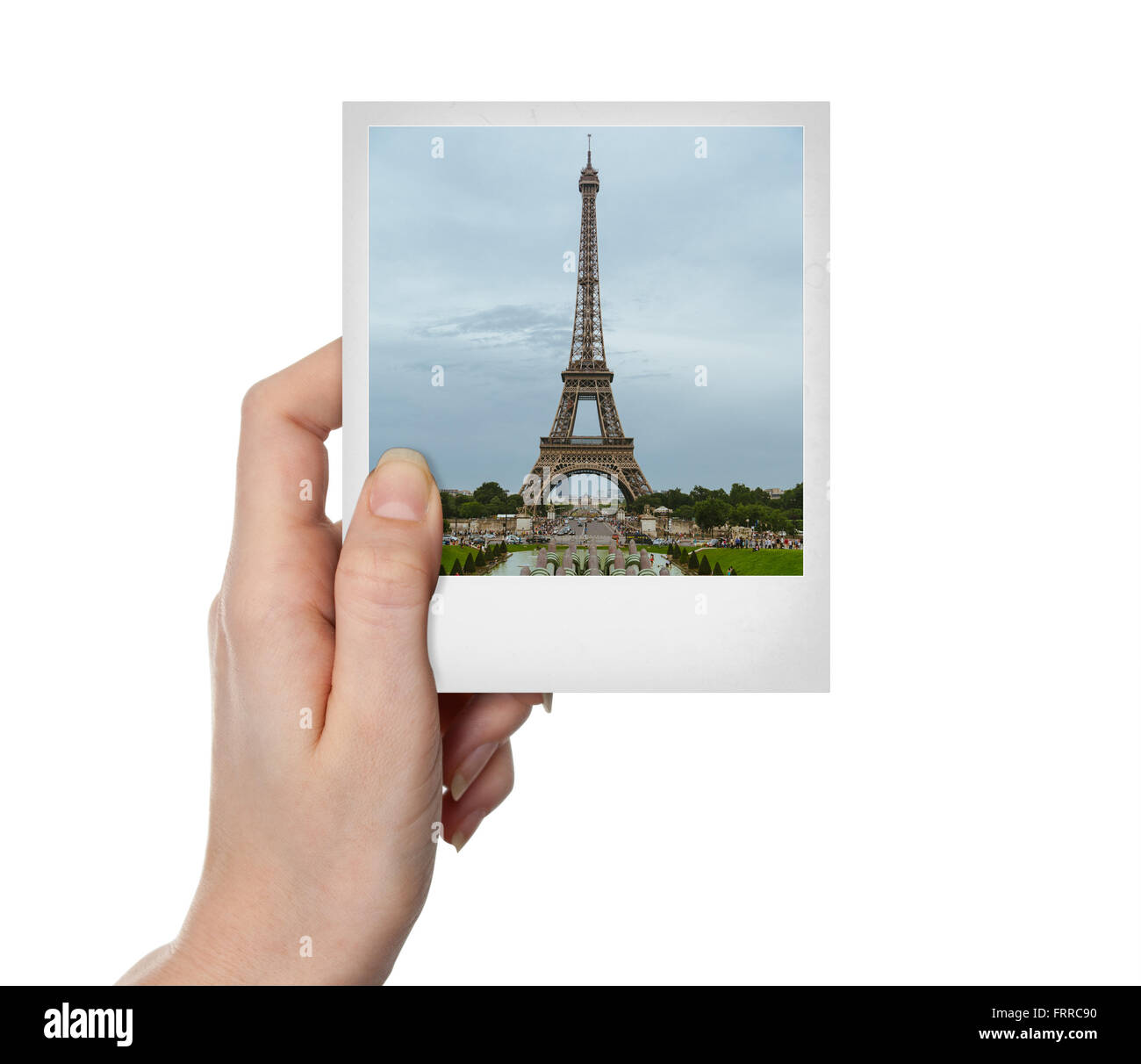 Mano azienda vintage foto della Torre Eiffel a Parigi su bianco Foto Stock