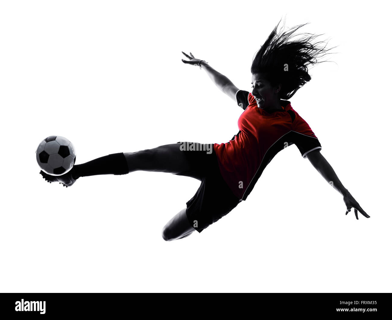 Una donna che giocano a calcio player in silhouette isolati su sfondo bianco Foto Stock