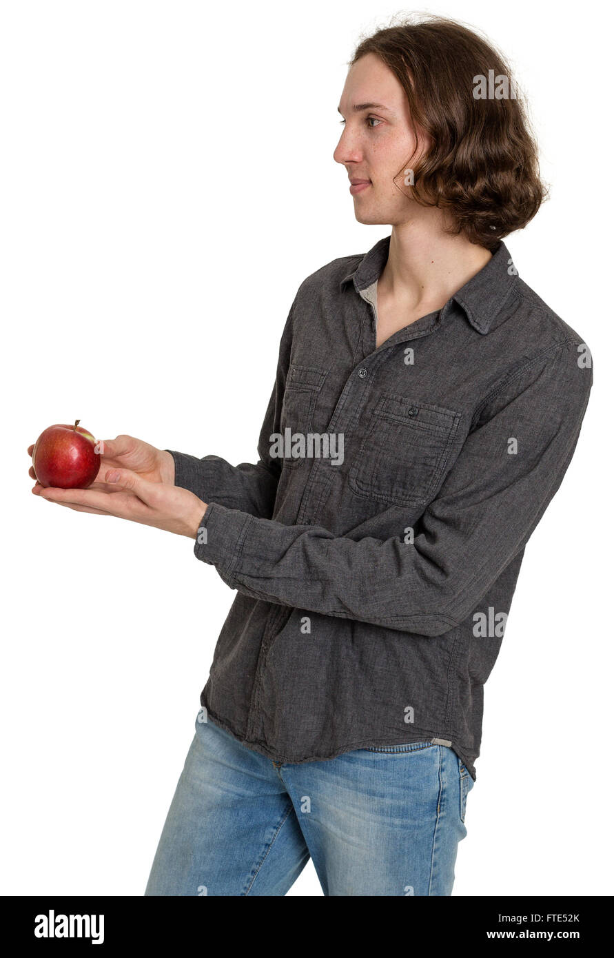 Giovane uomo tiene fuori un apple, isolato su bianco Foto Stock