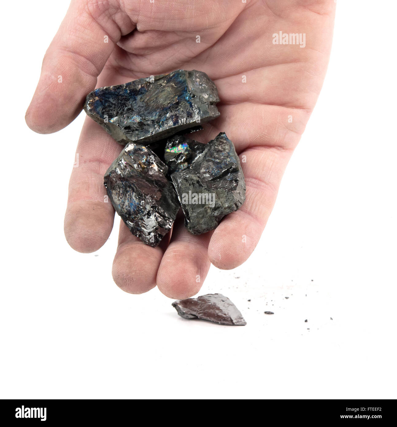 Mano del minatore nero carbone isolati su sfondo bianco Foto Stock