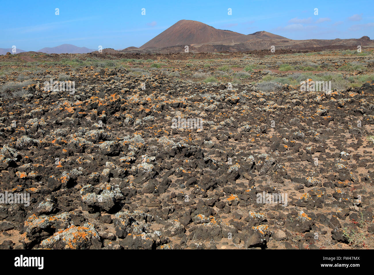 Rocky volcanic badlands 'malpais' paesaggio, Malpaís Grande parco nazionale, Fuerteventura, Isole Canarie, Spagna Foto Stock