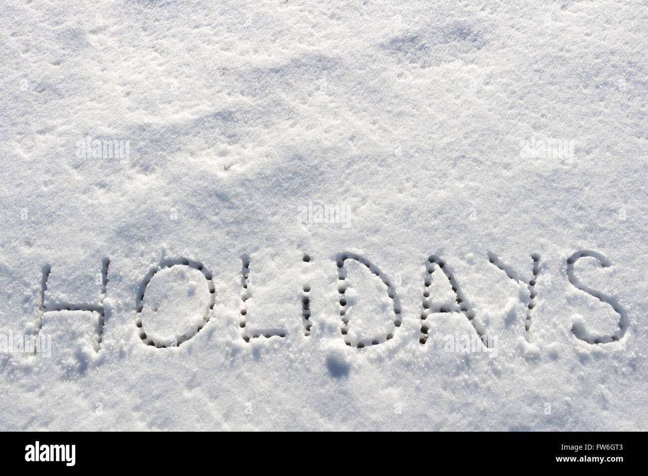 Parole scritte vacanze su un campo di neve Foto Stock