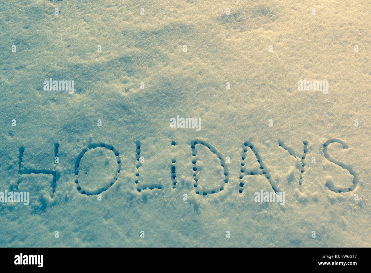 Parole scritte vacanze su un campo di neve Foto Stock