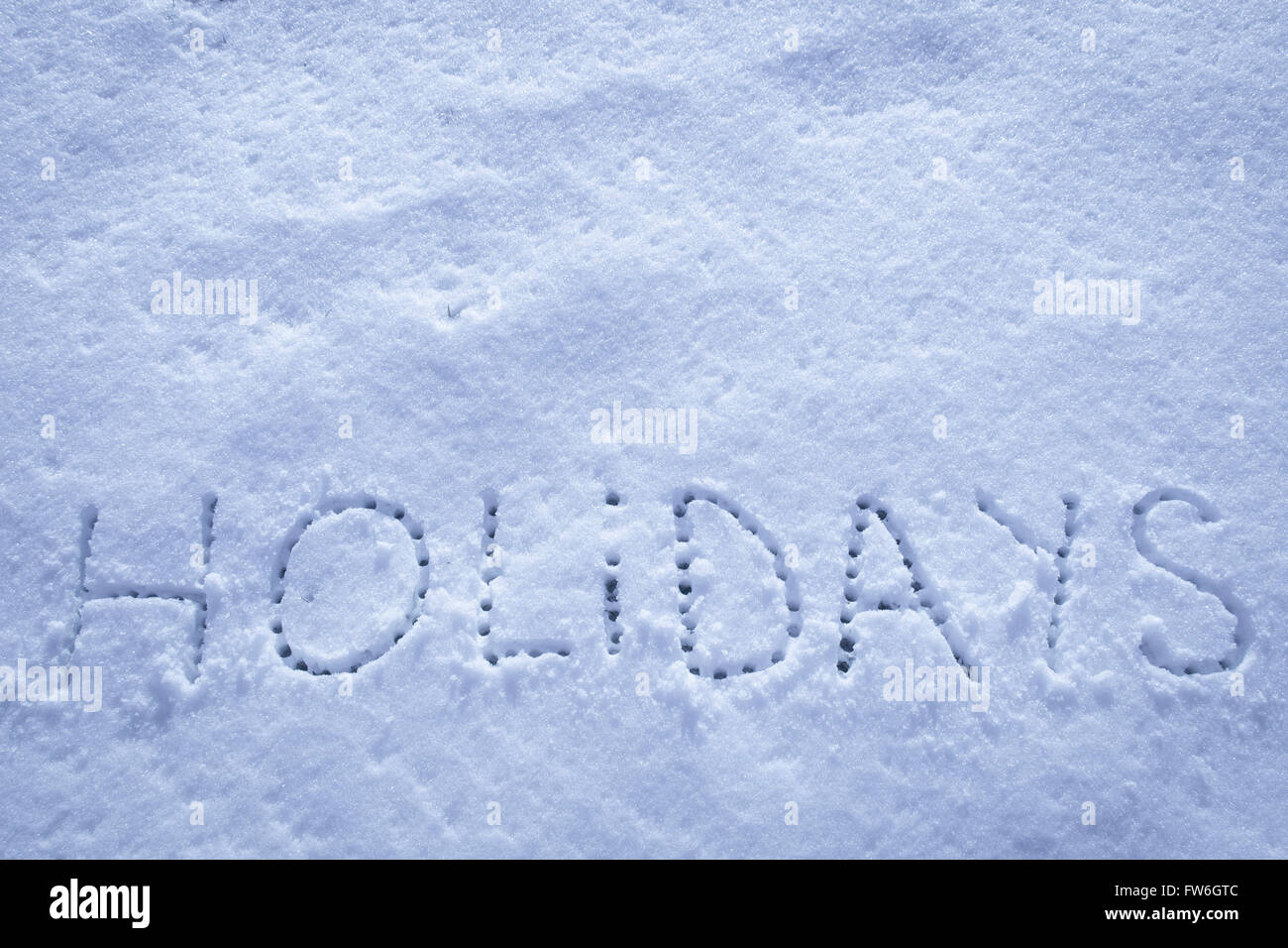 Parole scritte vacanze su un campo di neve Foto Stock