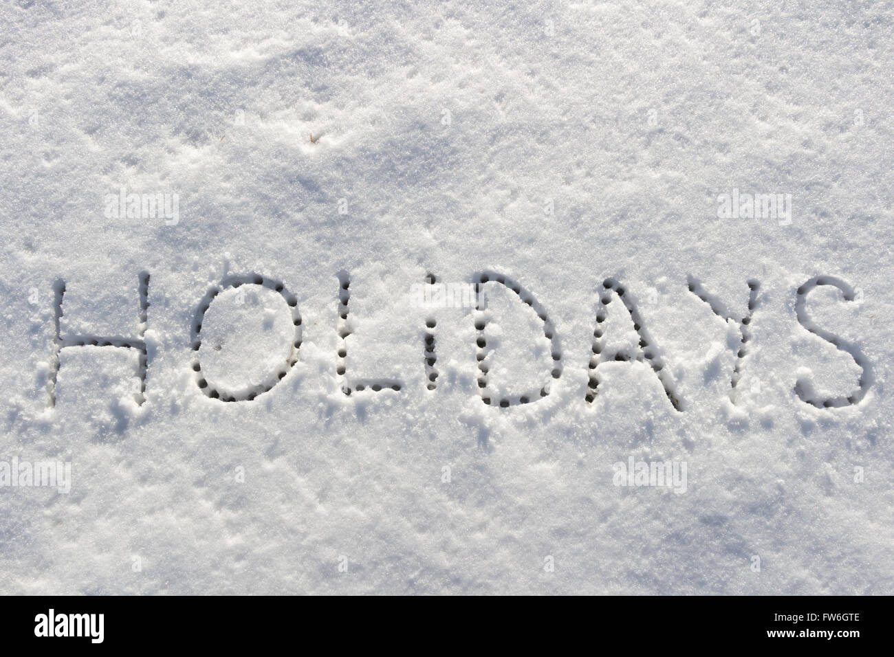 Parole scritte vacanze su un campo di neve Foto Stock