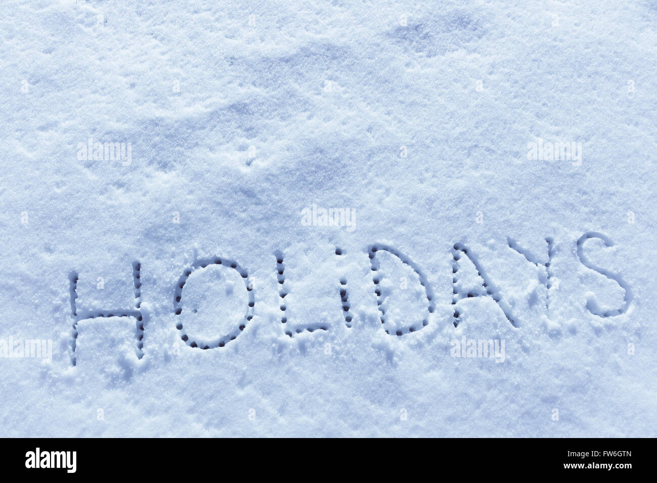 Parole scritte vacanze su un campo di neve Foto Stock