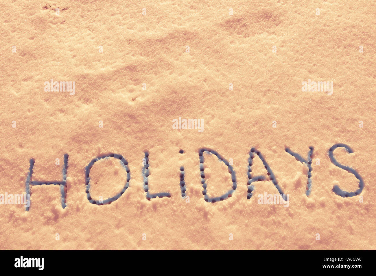 Parole scritte vacanze su un campo di neve Foto Stock