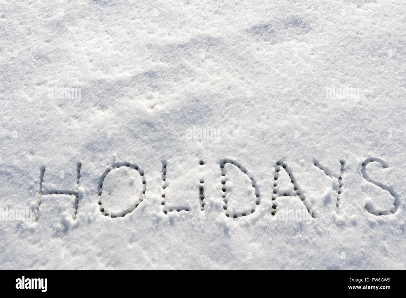 Parole scritte vacanze su un campo di neve Foto Stock