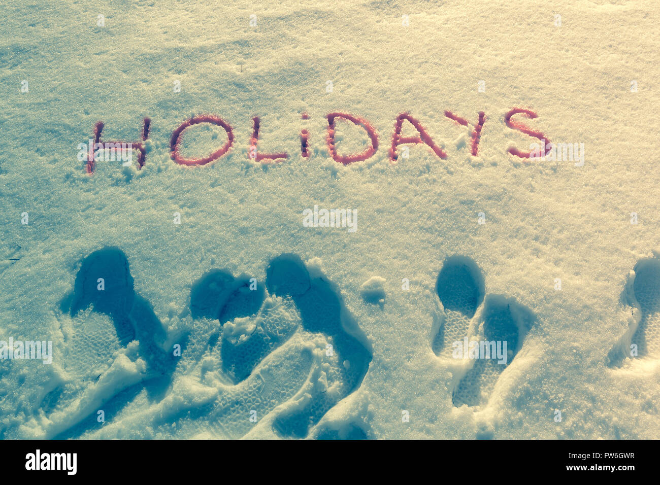 Parole scritte vacanze su un campo di neve Foto Stock