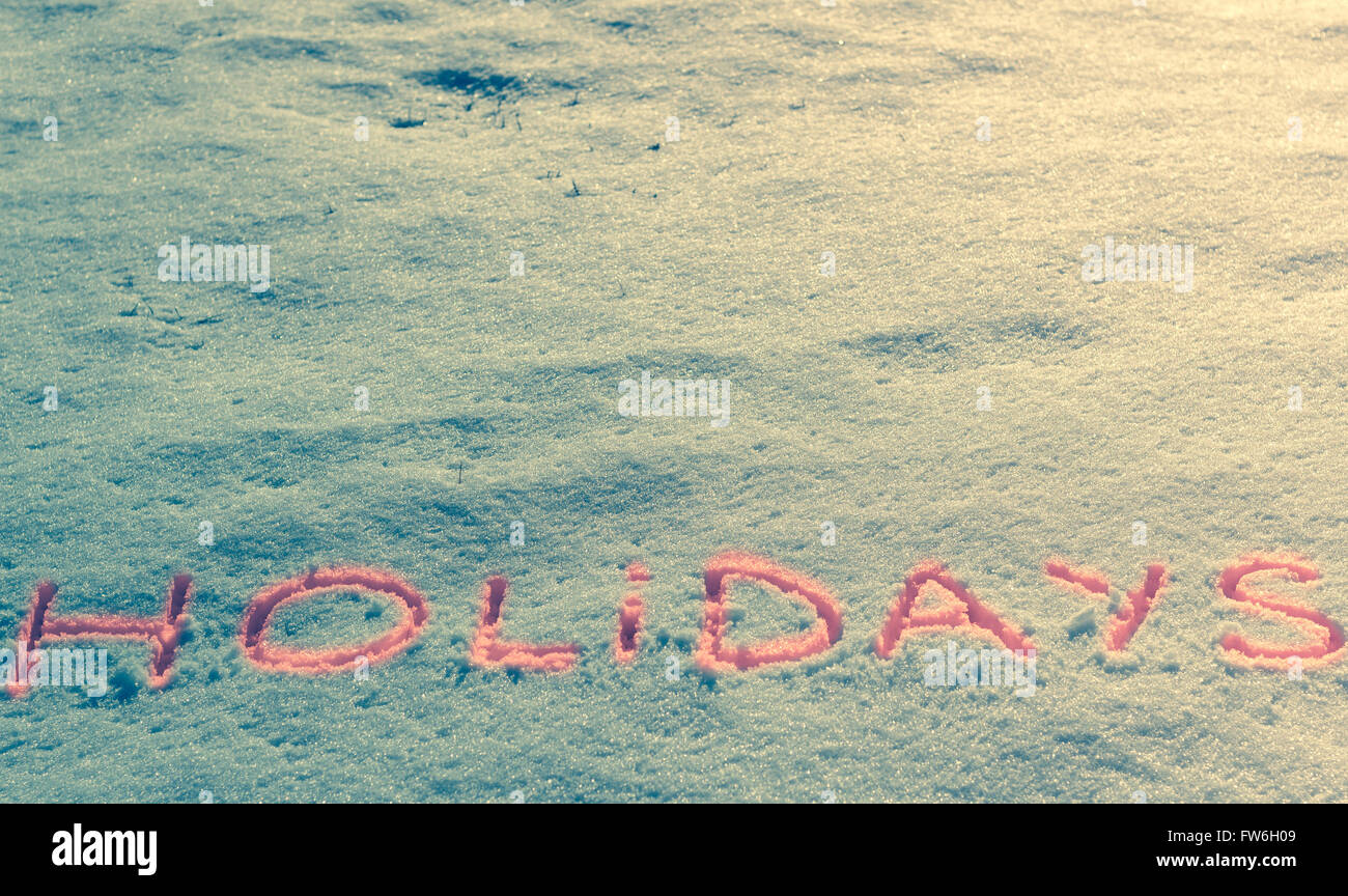 Parole scritte vacanze su un campo di neve Foto Stock