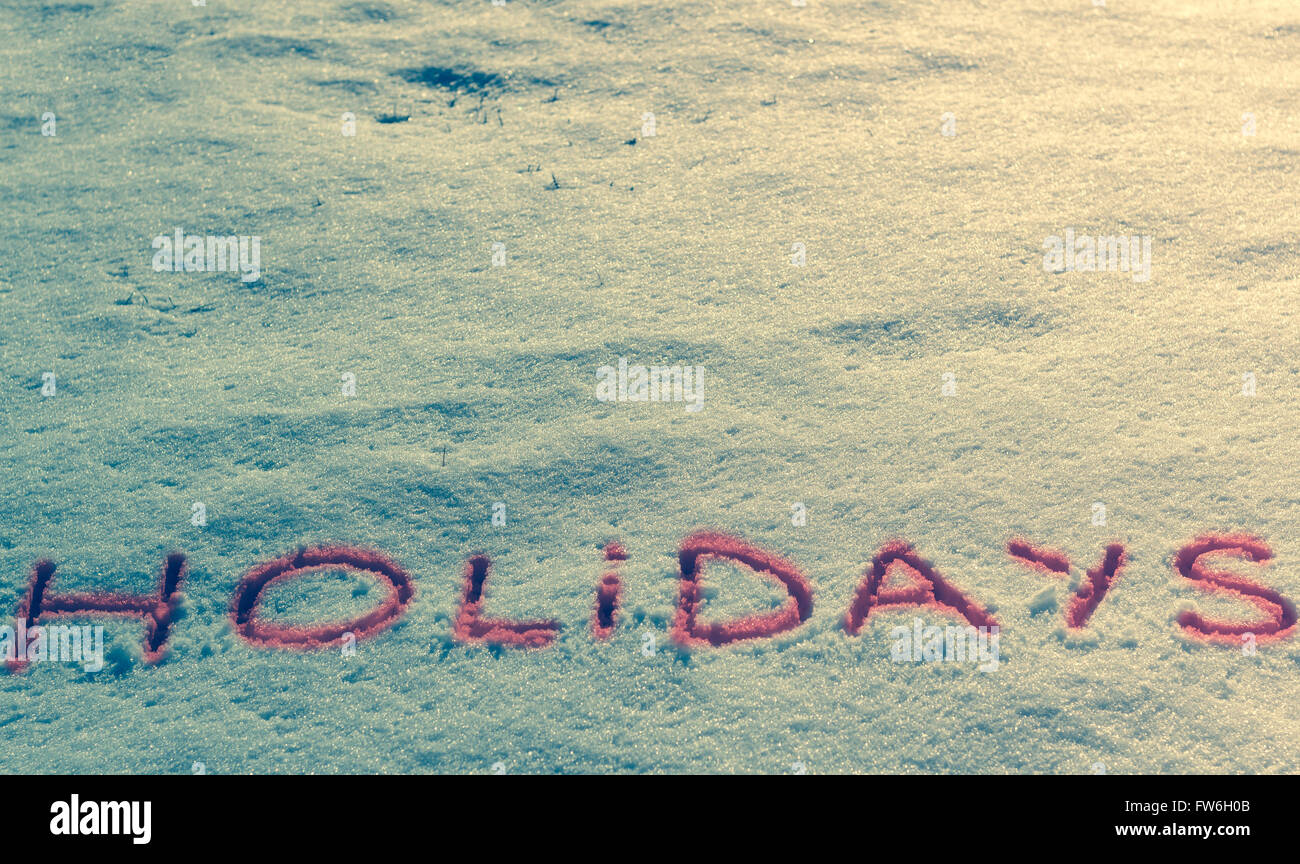 Parole scritte vacanze su un campo di neve Foto Stock