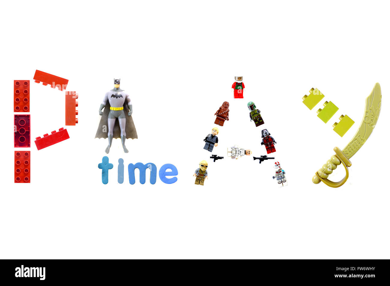La parola gioco creato da bambino giocattoli fotografati contro uno sfondo bianco. Foto Stock