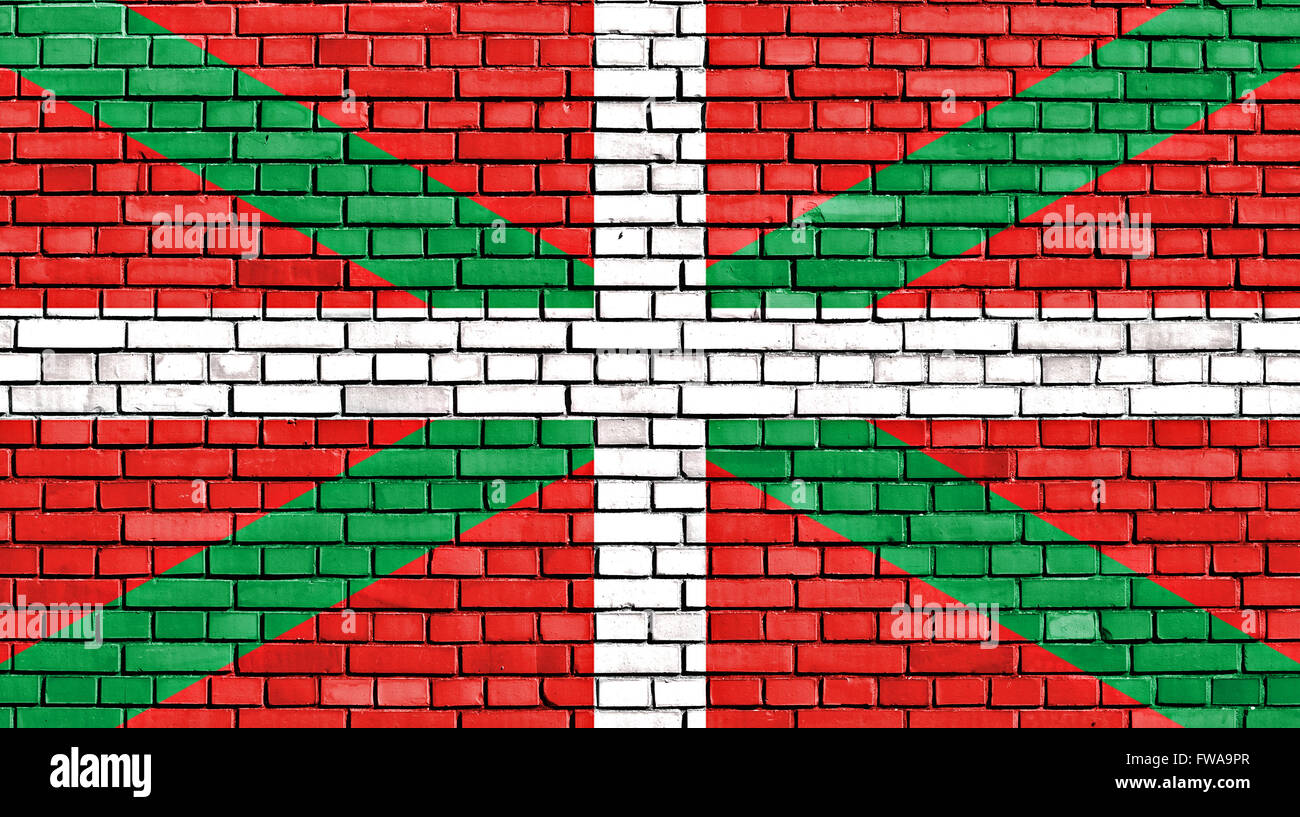 Bandiera del Paese Basco dipinta su un muro di mattoni Foto Stock