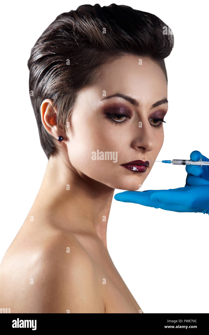 Giovane donna ottenere iniezione cosmetici Foto Stock