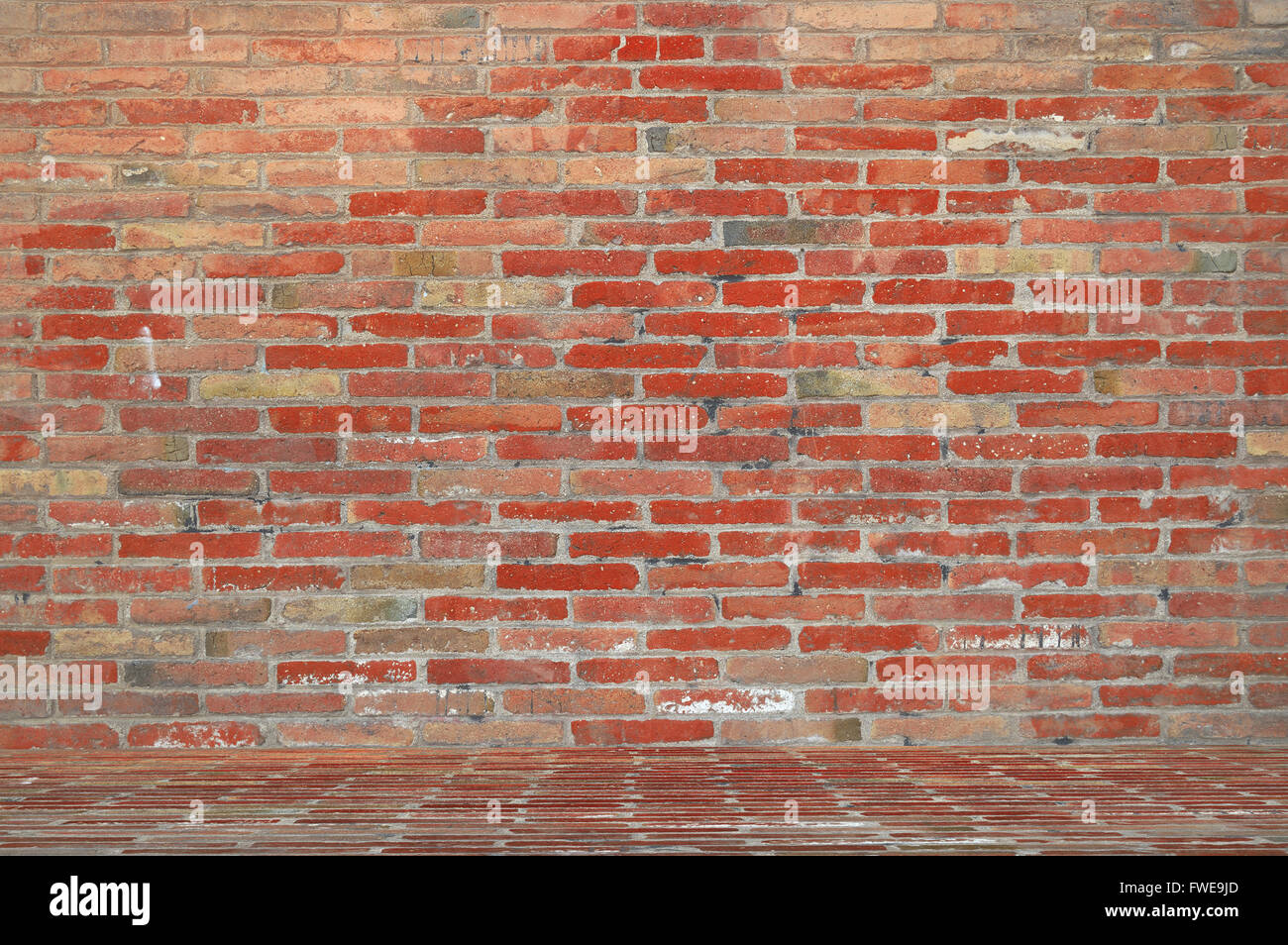 Mattone rosso sfondo parete in un fotografo foto studio. Svuotare lo spazio di copia per l'editor di testo. Foto Stock