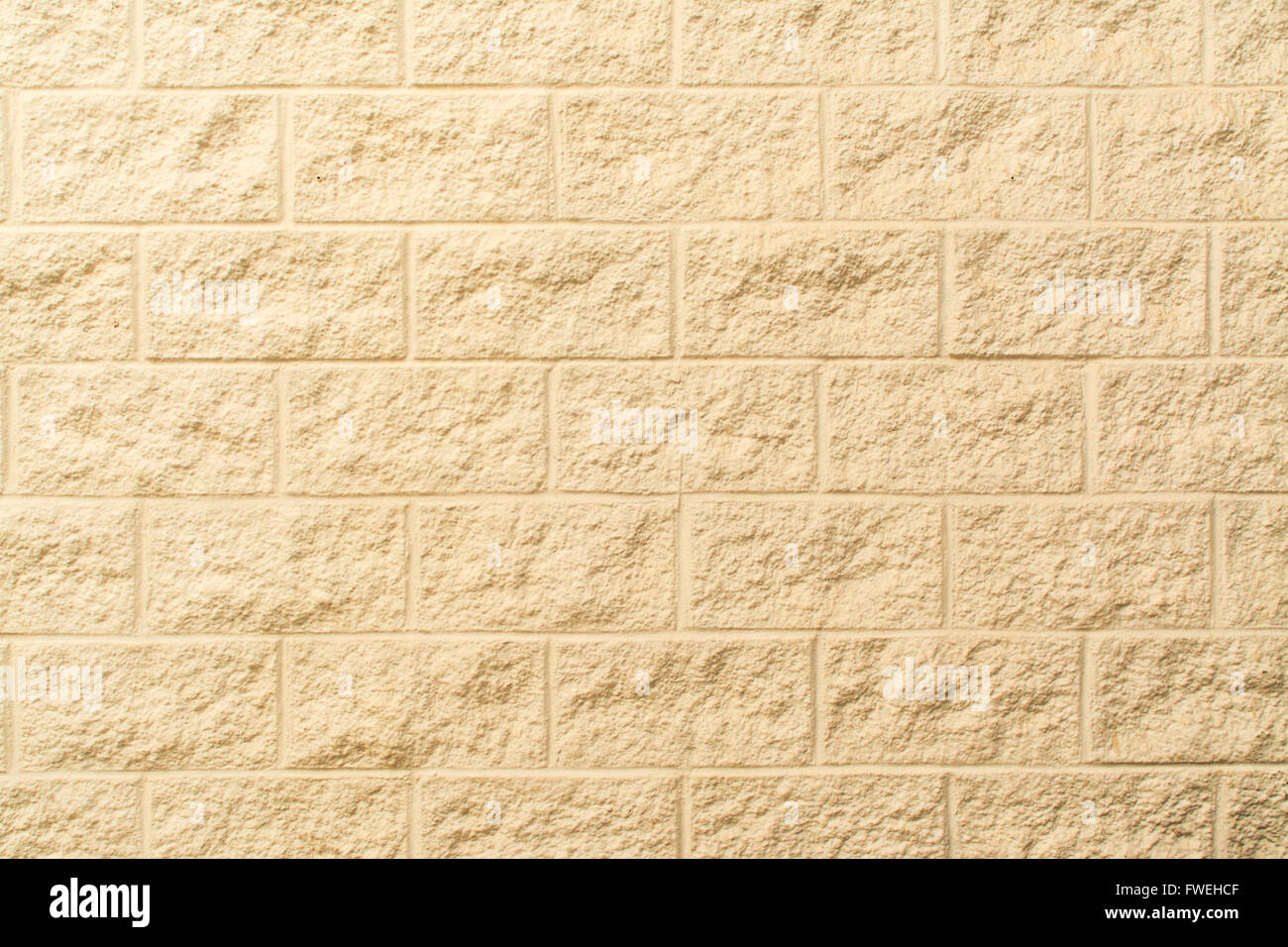 Crema blocco dipinte di un muro di mattoni per lo sfondo Foto Stock
