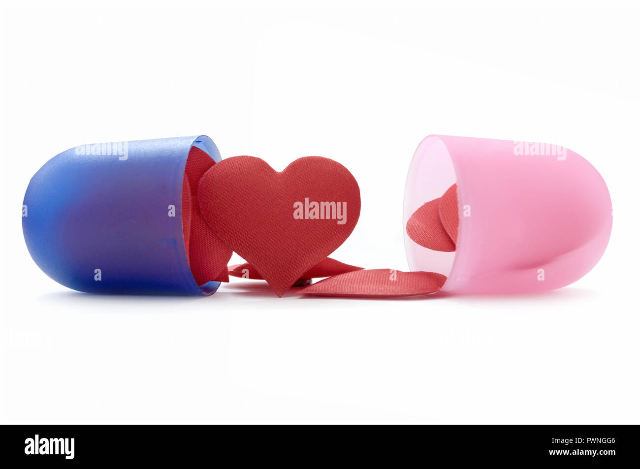 Forma di cuore pillole all'interno di una medicina pillola capsule Foto Stock