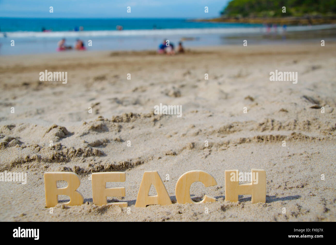 La parola Beach seduta su di una spiaggia di sabbia in Australia Foto Stock