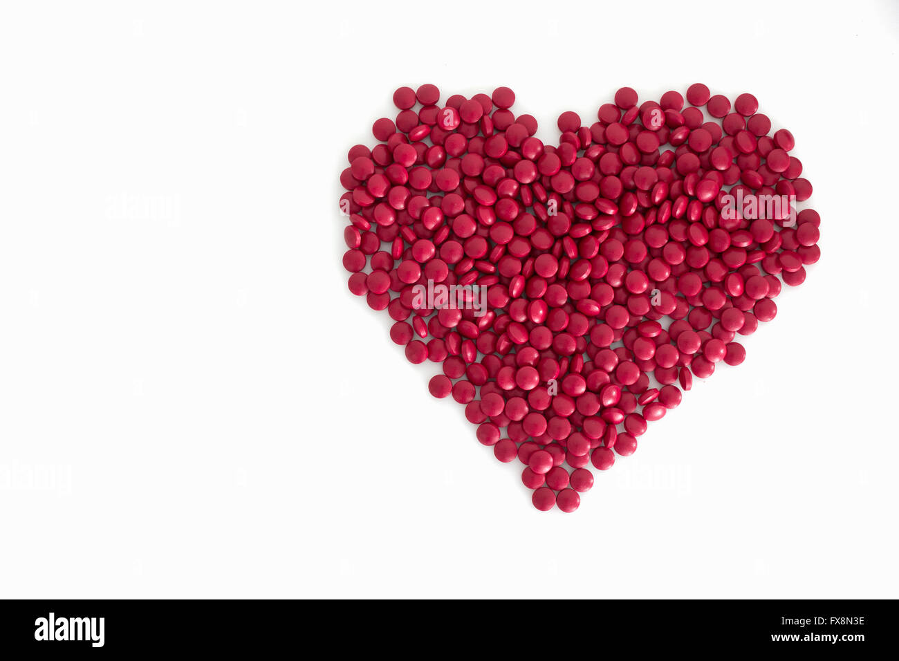 Farmaci rosso forma di cuore Foto Stock