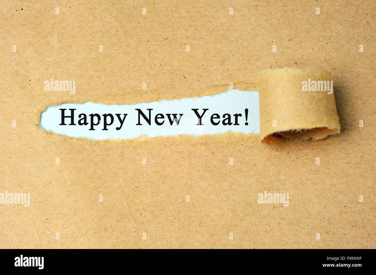 Carta strappata con 'Felice anno nuovo!" il testo. Foto Stock