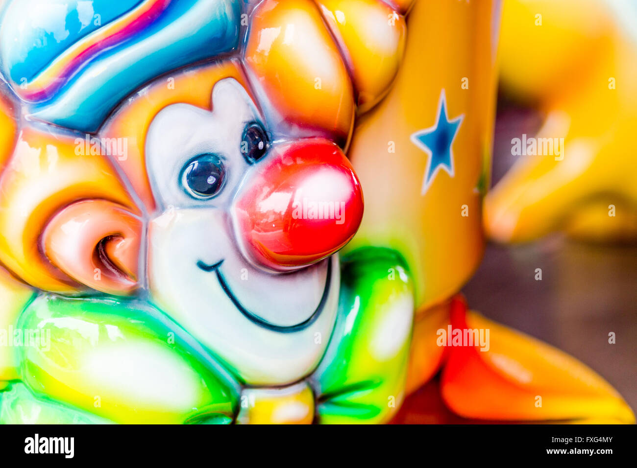 Close up merry-go-round sedili, clown Foto Stock