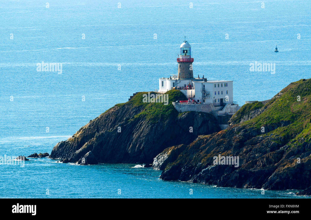 Le scogliere di Howth e faro, Irlanda Foto Stock